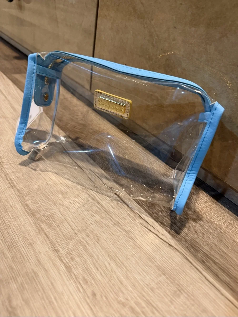 Lilly Pulitzer clear cosmetic pouch with light blue trim